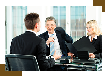 Three People Talking In A Room To Hire Mobile App Developer